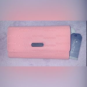 Brand new unused with tags Nautica wallet. Color Pink/Blush, has RFID Blocking